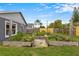 Landscaped backyard featuring a raised garden bed at 1616 Golden Poppy Ct, Orlando, FL 32824