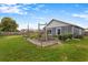 Fenced backyard featuring a raised garden bed at 1616 Golden Poppy Ct, Orlando, FL 32824