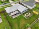 Aerial view of the backyard featuring a patio with outdoor furniture and a well-maintained garden at 1616 Golden Poppy Ct, Orlando, FL 32824