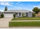 Charming single-story home featuring a well-manicured lawn and a welcoming front entrance at 1616 Golden Poppy Ct, Orlando, FL 32824
