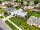 Aerial view of a single-Gathering home with manicured lawn, mature trees and well-kept landscaping at 1616 Golden Poppy Ct, Orlando, FL 32824