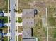 Aerial view showing roof lines, driveways, and manicured lawns in a well-planned neighborhood at 1791 Hackberry St, Clermont, FL 34715