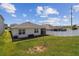 Fenced backyard with green grass, providing privacy and room for recreation at 1791 Hackberry St, Clermont, FL 34715