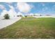 Picturesque backyard featuring a lush green lawn and a sturdy white fence at 1791 Hackberry St, Clermont, FL 34715