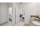 Bathroom featuring dual sinks and an adjoining toilet room and bedroom at 1791 Hackberry St, Clermont, FL 34715