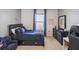 Bedroom with carpet, a bed with a character theme, dresser, and matching curtains at 1791 Hackberry St, Clermont, FL 34715