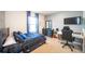 Cozy bedroom featuring a twin bed, modern furniture, and a comfortable workspace at 1791 Hackberry St, Clermont, FL 34715