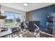 Unique office/bedroom featuring an exterior view and custom shelving at 1791 Hackberry St, Clermont, FL 34715