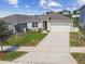Charming single-story home featuring a well-maintained lawn and attached two-car garage at 1791 Hackberry St, Clermont, FL 34715