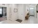 Hallway featuring tile flooring, neutral walls, and multiple doors at 1791 Hackberry St, Clermont, FL 34715