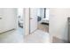 Bright hallway with tile floors and view to bathroom and bedroom at 1791 Hackberry St, Clermont, FL 34715