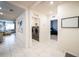 Hallway view of laundry room with modern machines and open access to a comfortable, modern living space at 1791 Hackberry St, Clermont, FL 34715