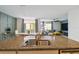 Kitchen island features granite countertops and stainless steel sink with open layout to the living space at 1791 Hackberry St, Clermont, FL 34715