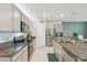 Modern kitchen with stainless steel appliances, granite countertops and ample cabinet space for storage at 1791 Hackberry St, Clermont, FL 34715