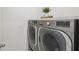 Modern laundry room showcasing high-end stainless steel washer and dryer set at 1791 Hackberry St, Clermont, FL 34715