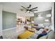 Inviting living room offers a seamless transition to the kitchen, creating a connected and social atmosphere at 1791 Hackberry St, Clermont, FL 34715
