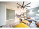 Bright, open-concept living room featuring tile floors, a sectional sofa, and stylish decor at 1791 Hackberry St, Clermont, FL 34715