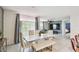 Open living space showcases modern dining area and comfortable seating, filled with natural light at 1791 Hackberry St, Clermont, FL 34715