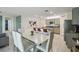 Open layout connecting dining and kitchen creates a seamless flow for modern living and entertaining at 1791 Hackberry St, Clermont, FL 34715
