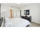 Bright bedroom showcasing a modern dresser and neutral décor at 1791 Hackberry St, Clermont, FL 34715