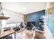 Well-equipped home office with a large world map, dual monitors, and modern decor at 1791 Hackberry St, Clermont, FL 34715