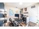 Bright, modern home office featuring a large world map and dual monitors for efficient work at 1791 Hackberry St, Clermont, FL 34715