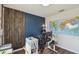Bright office with hardwood floors, decorative wood wall and expansive world map at 1791 Hackberry St, Clermont, FL 34715