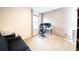 Cozy office space with a comfortable couch, large window, and desk with dual monitors at 1791 Hackberry St, Clermont, FL 34715