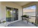 Cozy screened porch with grill and furniture for relaxing at 1791 Hackberry St, Clermont, FL 34715