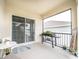 Cozy screened porch with grill and table, overlooking the serene backyard at 1791 Hackberry St, Clermont, FL 34715
