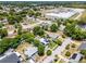 This aerial view showcases a residential neighborhood with mature trees and nearby community amenities at 1872 Wayside Dr, Orlando, FL 32818