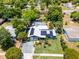 Charming home featuring a well-manicured front lawn, solar panels, and a convenient driveway at 1872 Wayside Dr, Orlando, FL 32818