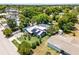 Beautiful home featuring solar panels, lush greenery, a convenient driveway, and mature trees at 1872 Wayside Dr, Orlando, FL 32818
