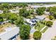 Charming home featuring solar panels, mature trees, lush greenery, and a convenient driveway at 1872 Wayside Dr, Orlando, FL 32818