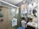 Bathroom with a glass-enclosed shower and a vanity with decorative accents at 1872 Wayside Dr, Orlando, FL 32818