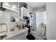 Bright bathroom with white marble tile, a vanity with a mirror, and an enclosed shower at 1872 Wayside Dr, Orlando, FL 32818