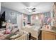 Charming bedroom with a crib, a changing table, and soft pink accents at 1872 Wayside Dr, Orlando, FL 32818