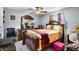 Bedroom with dark wood furniture and grey wood-look flooring at 1872 Wayside Dr, Orlando, FL 32818
