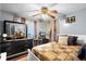 Bedroom featuring a large black dresser, a desk, and natural light at 1872 Wayside Dr, Orlando, FL 32818