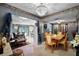 Bright dining room with a chandelier, neutral tones, and a view into other living spaces at 1872 Wayside Dr, Orlando, FL 32818