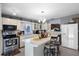 Spacious eat-in kitchen with center island, white cabinetry, and tile floor at 1872 Wayside Dr, Orlando, FL 32818