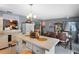 Spacious kitchen with center island, white cabinetry, tile floors, and dining room access at 1872 Wayside Dr, Orlando, FL 32818