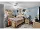 Luxurious main bedroom with detailed furniture, neutral carpeting, and ample natural light at 1872 Wayside Dr, Orlando, FL 32818