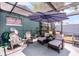 Relaxing patio area with comfortable seating, shaded by a large umbrella at 1872 Wayside Dr, Orlando, FL 32818