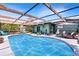 Enclosed pool area with comfortable patio seating, perfect for backyard enjoyment at 1872 Wayside Dr, Orlando, FL 32818
