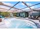 Sparkling pool area featuring a screened enclosure, comfortable seating, and a relaxing atmosphere at 1872 Wayside Dr, Orlando, FL 32818