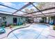 Screened-in pool with covered area, poolside seating, and ample space for outdoor enjoyment at 1872 Wayside Dr, Orlando, FL 32818