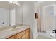 Bathroom with a single sink vanity and a combined tub and shower with curtain at 1913 Lazy Oaks Loop, St Cloud, FL 34771