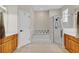 Bathroom featuring dual wood vanities, glass shower enclosure, and tiled soaking tub at 1913 Lazy Oaks Loop, St Cloud, FL 34771