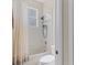 Bathroom featuring a tub and shower with a shower head and a modern, clean design at 1913 Lazy Oaks Loop, St Cloud, FL 34771